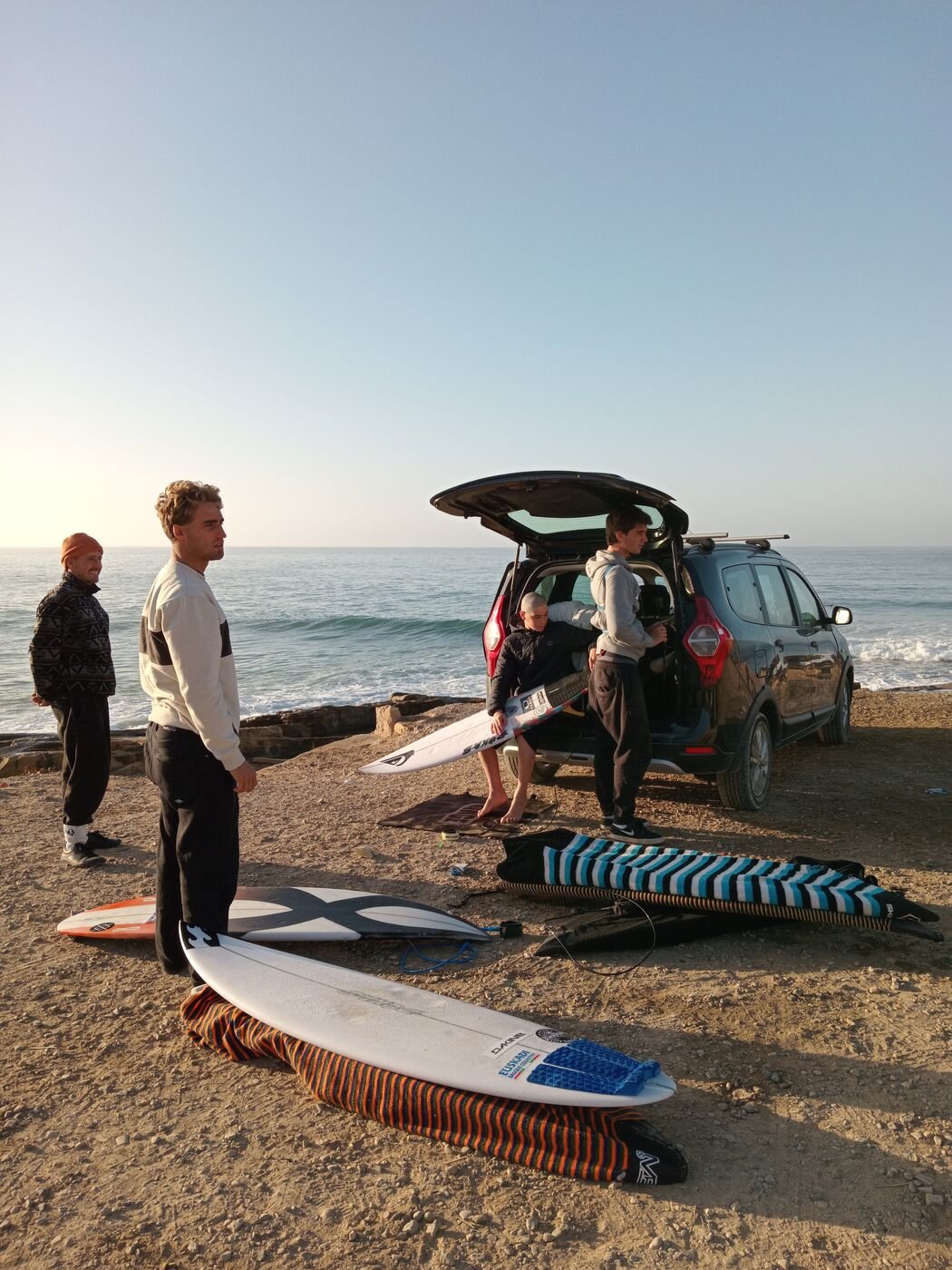 Surfboards and van at a coastal spot